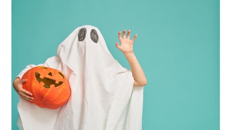 little kid in ghost costume