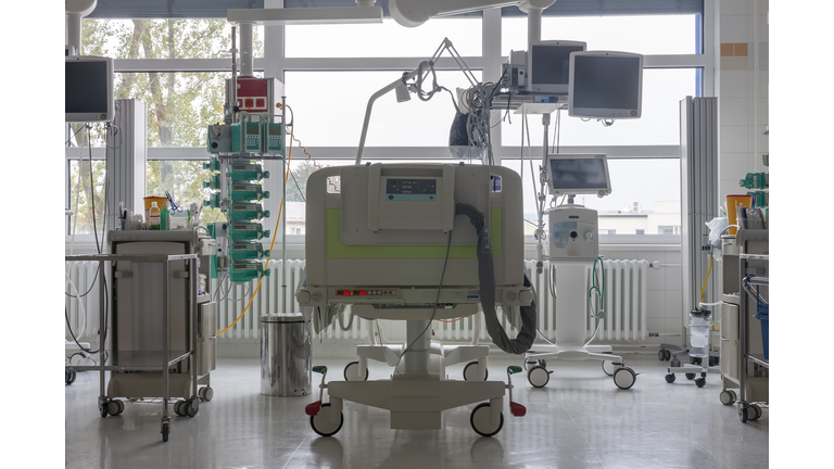 Intensive care unit in hospital, bed with monitors, ventilator, a place where can be  treated patients with pneumonia caused by coronavirus covid 19.