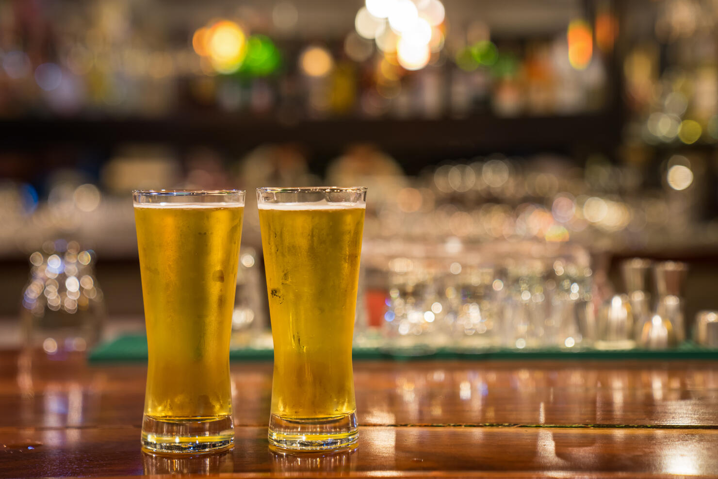 Glass of beer on the bar counter.