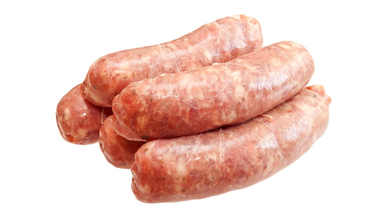 Raw meat sausages isolated on white background