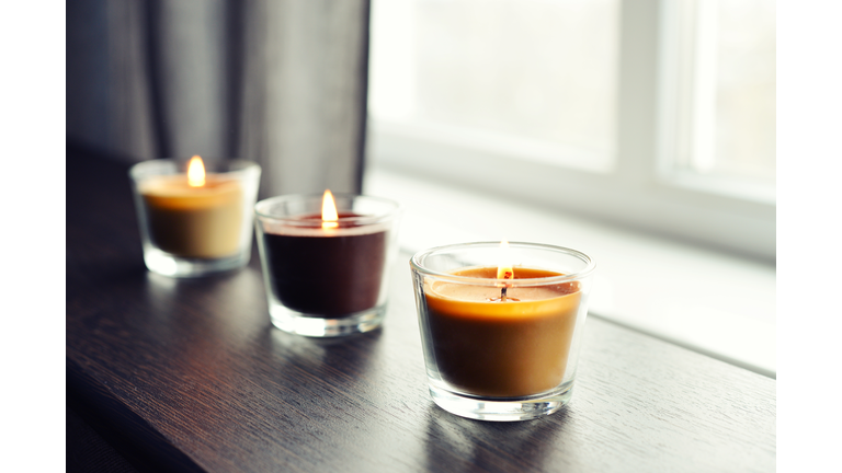 Cosy candles on an wooden table