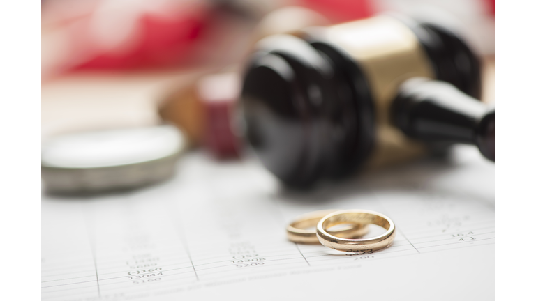 Gavel and wedding rings