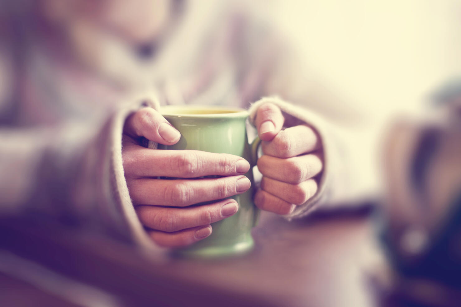 Woman with mug of tea