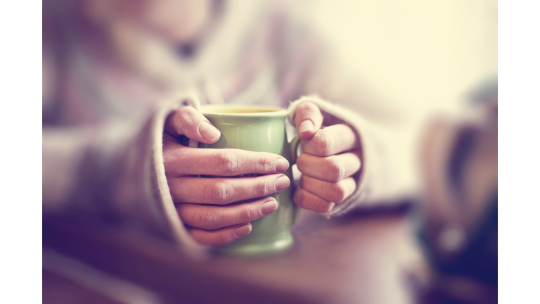 Woman with mug of tea