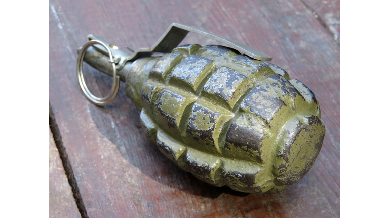 Soviet and russian hand grenade F-1 on wooden table