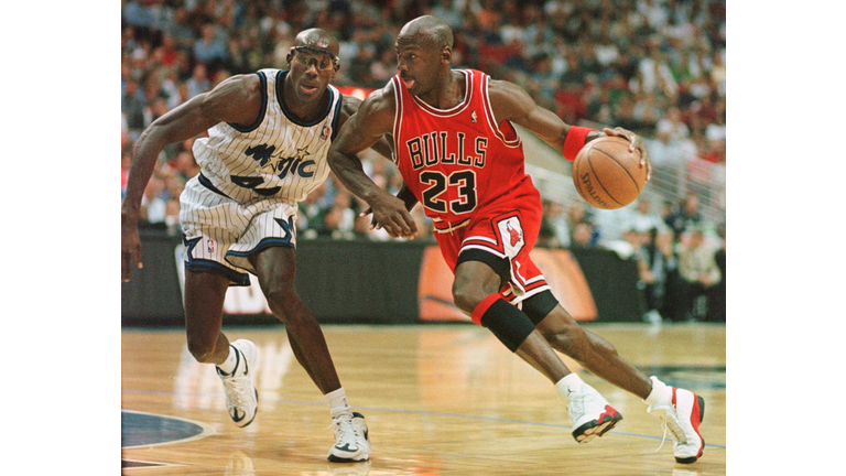 Chicago Bulls guard Michael Jordan drives past Orl