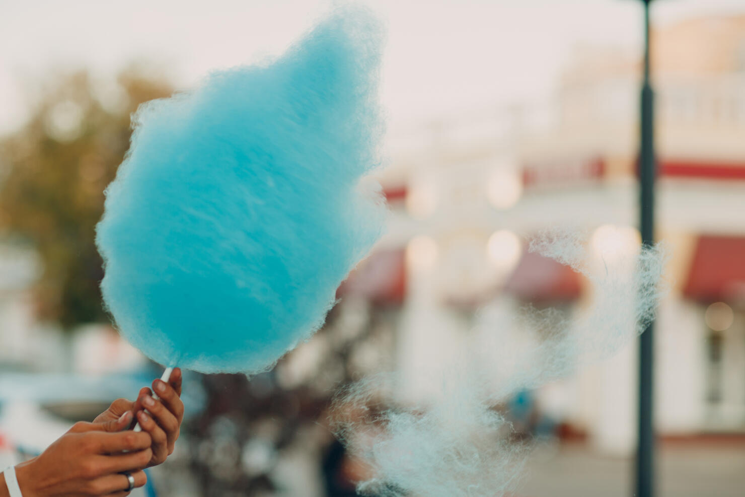 Cotton Candy floss machine making blue candyfloss outdoor