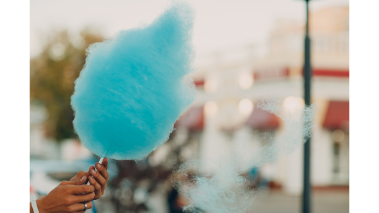 Cotton Candy floss machine making blue candyfloss outdoor