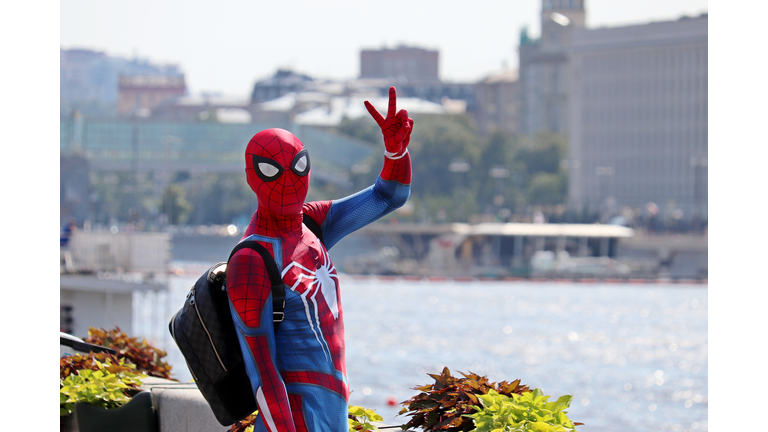 Person in Spider-man costume shows the victory sign