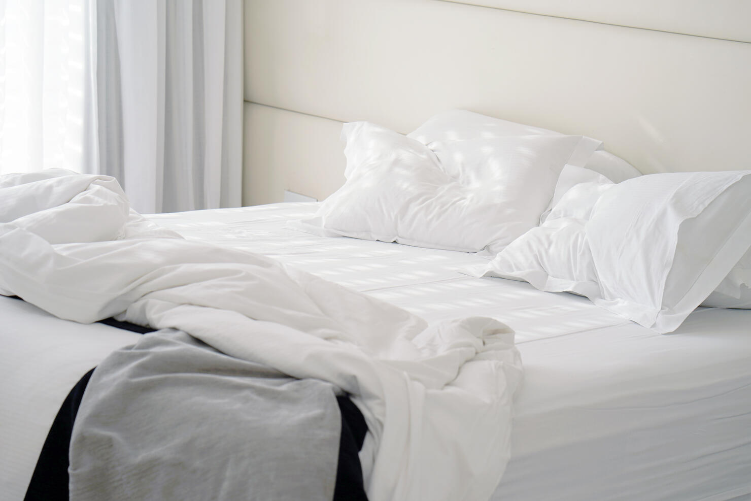 Dirty bed in the hotel. Dirty bed pillow blanket room.