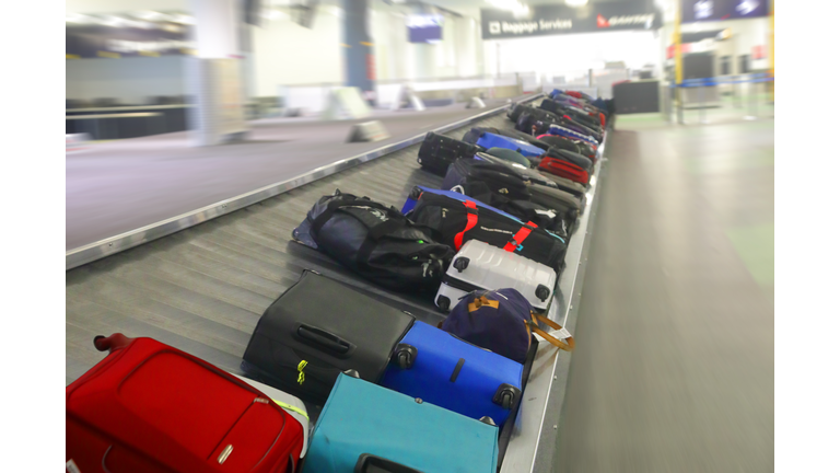 luggage on airport conveyor belt