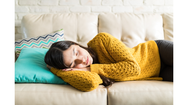 Woman Sleeping Comfortably In Living Room