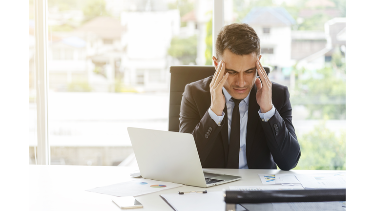 High pressure of businessman in office. Seriously work, headache.