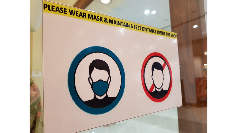 Safety or warning signs for wearing surgical face mask before entering in shops during Corona Virus (Covid-19) pandemic.