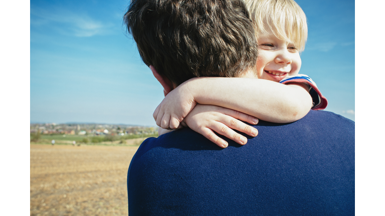 Father and son hugging