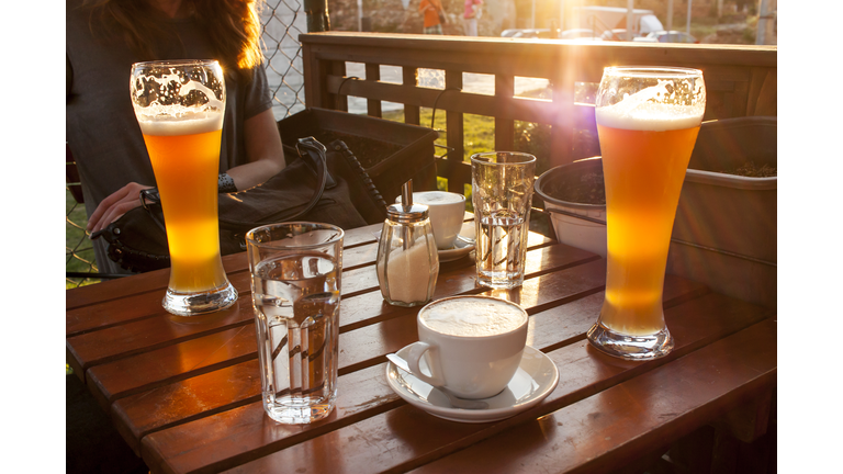 Beer and coffee on wooden table