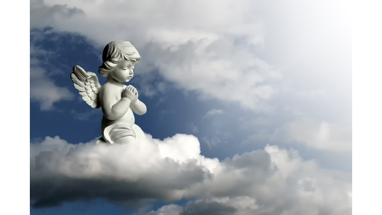 Guardian angel kneeling and praying. Angel guardian on the cloud