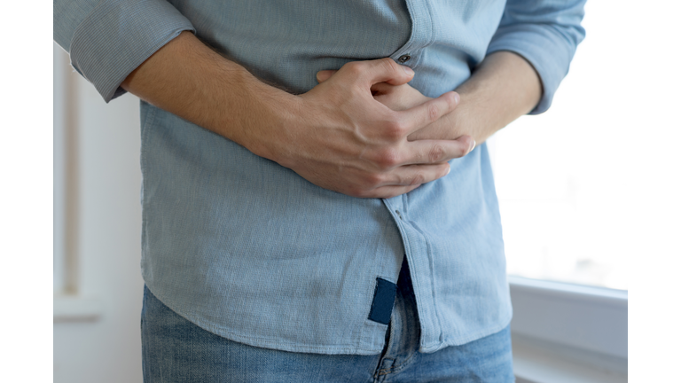 Young man having stomach ache