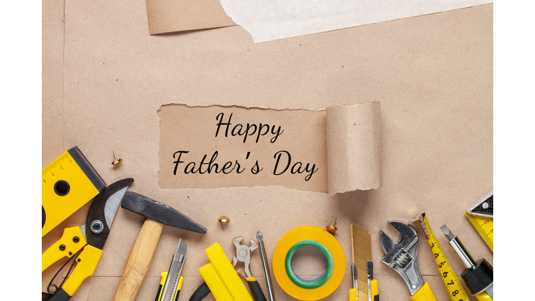 Set of different repair tools on kraft paper background and Text Happy Fathers Day