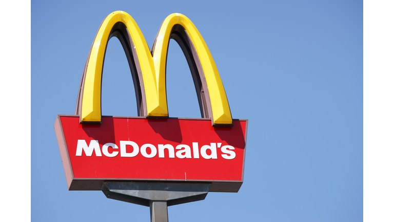 Close-up McDonalds outdoor sign against blue sky