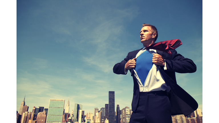 Superhero Young Man Businessman Standing Outdoors Over City Skyline