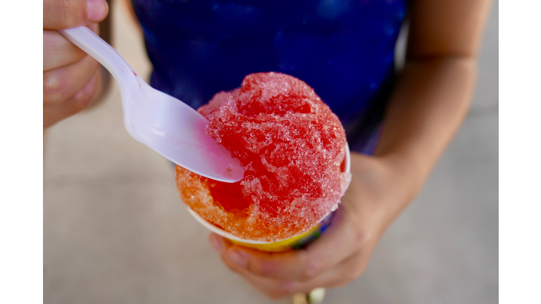 Close up of snow cone held by a child