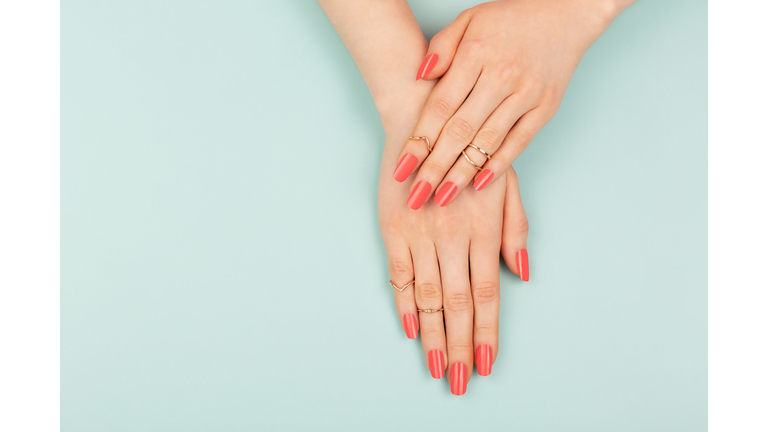 Woman hands on blue background