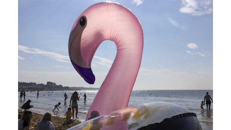 Beachgoers Enjoy Continued Warm Weather After Gloomy Spring