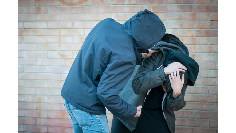 Bullying, aggression and violence scene between two young adult males