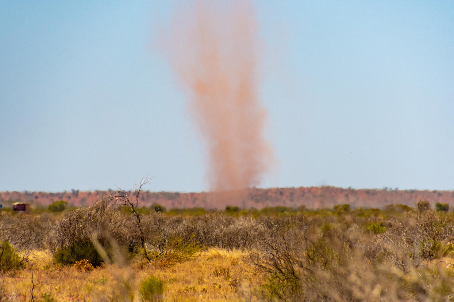 Red landspout whirlwind sand tornado dust devil in Australian dessert