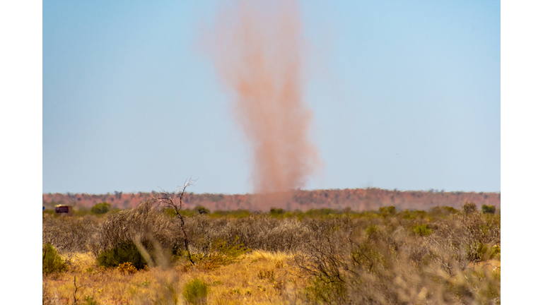 Red landspout whirlwind sand tornado dust devil in Australian dessert