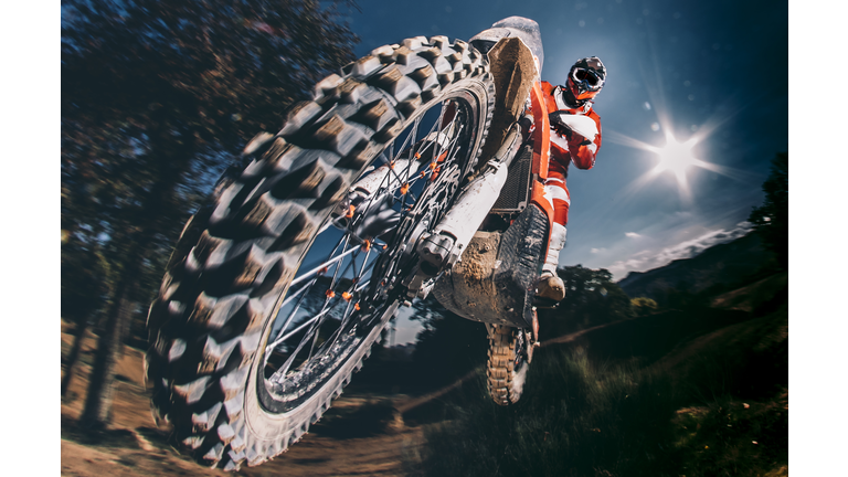 Motocross biker jumping
