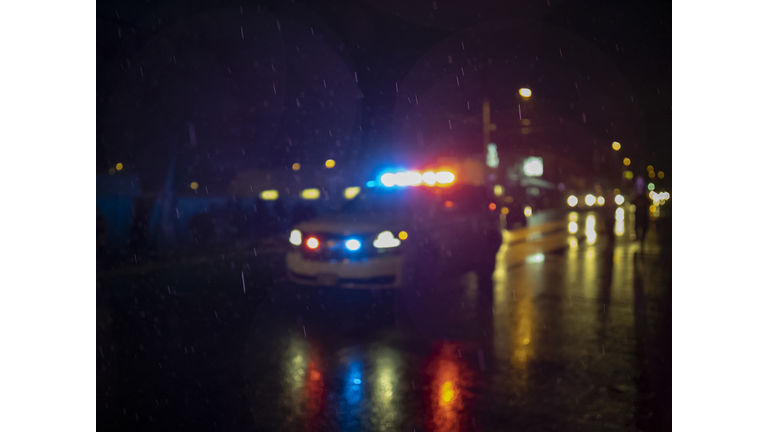 Police Car Lights Blurred Out of Focus on City Street