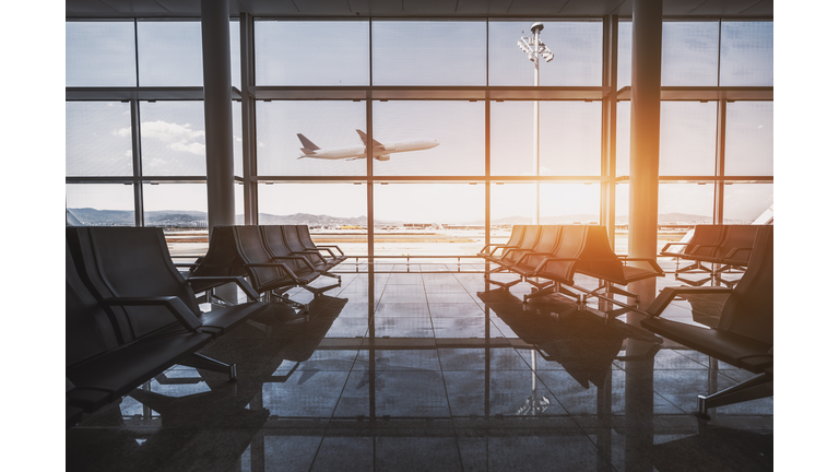Airport waiting room, flying plane