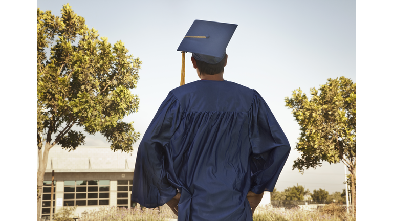 Rear view of graduate in cap and gown