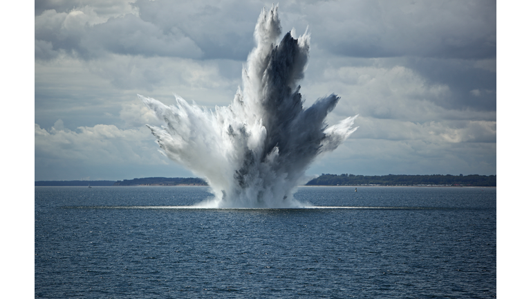 Huge Water Fountain caused by an below Surface Explosion of a Sea Mine in the Ocean