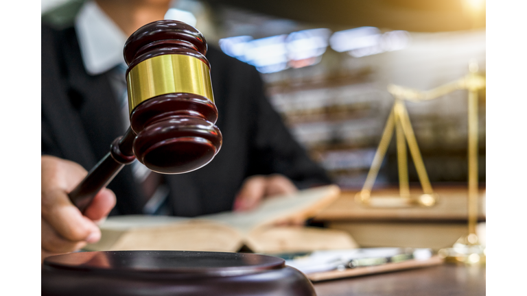 Close up of judge holding gavel