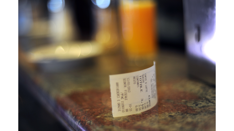 A till receipt is displayed on a bar on