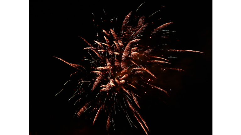 Celebration firework in the black night sky