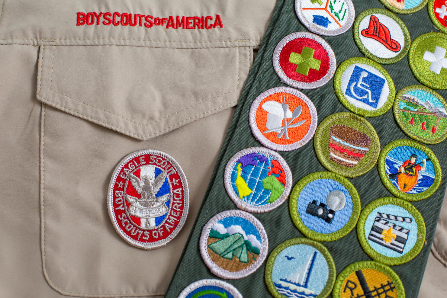 Eagle patch and merit badge sash on boy scout uniform