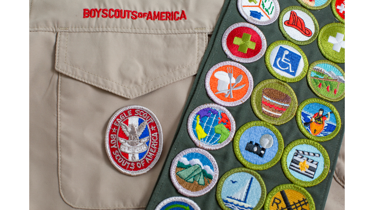 Eagle patch and merit badge sash on boy scout uniform