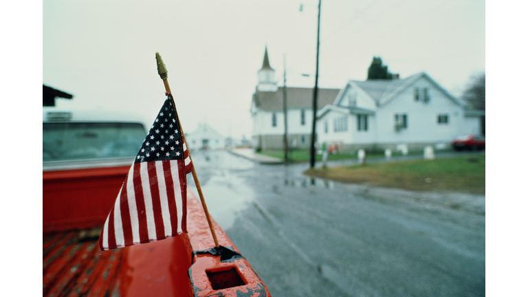 Stars and Stripes on back of pickup truck, USA