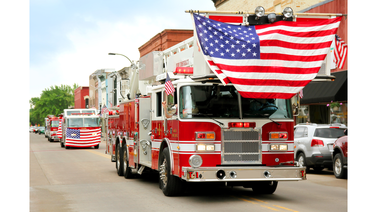 Fire Trucks with American Flags at Small Town Parade