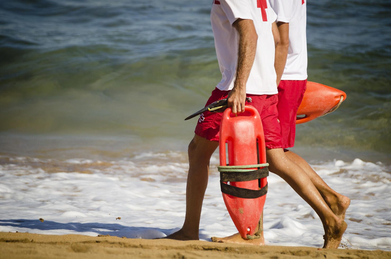Lifeguards walking on the beach