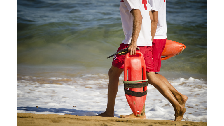 Lifeguards walking on the beach