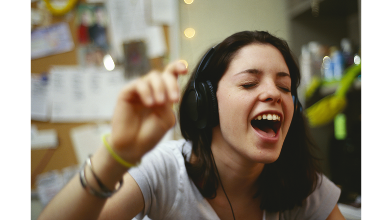 Teenage Girl Listening to Music on Headphones