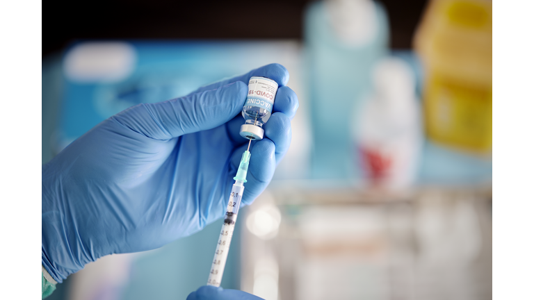 A Healthcare Worker Prepares a Dose of COVID-19 Vaccine.