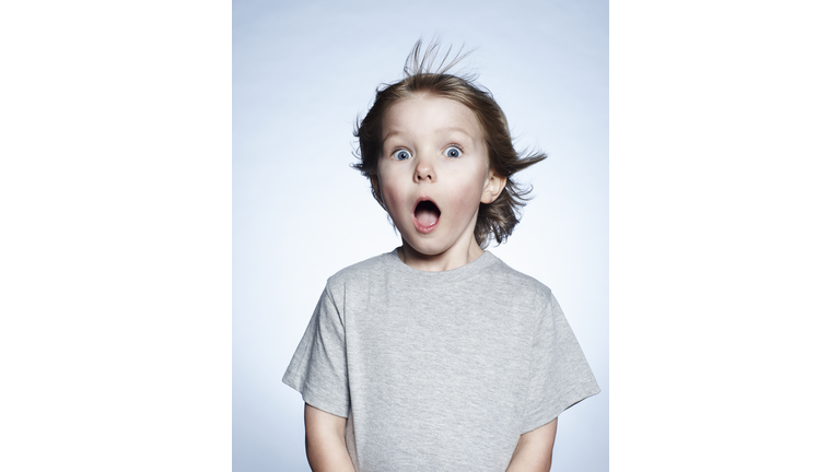 Portrait of boy looking surprised