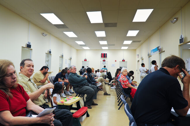 Customers que in DMV waiting room