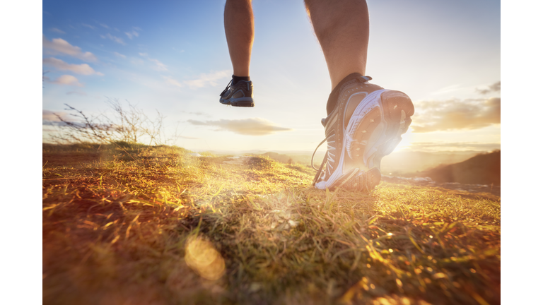 Cross-country running in early morning sunrise